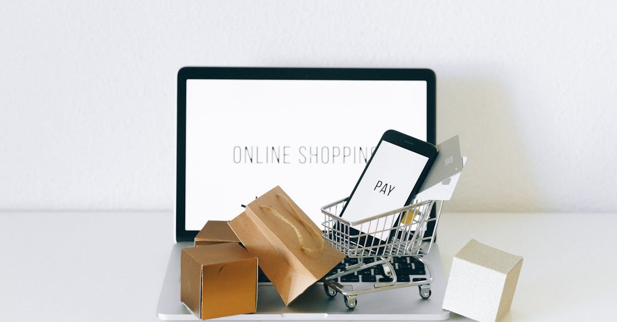 Display of online shopping theme with mini cart and payment devices on laptop.