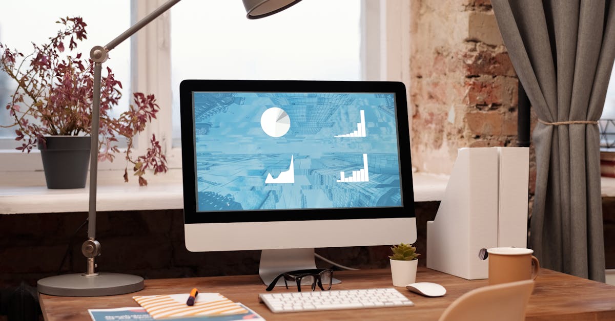 Clean and modern home office setup with computer, lamp, and decor. Ideal for productivity in a contemporary workspace.