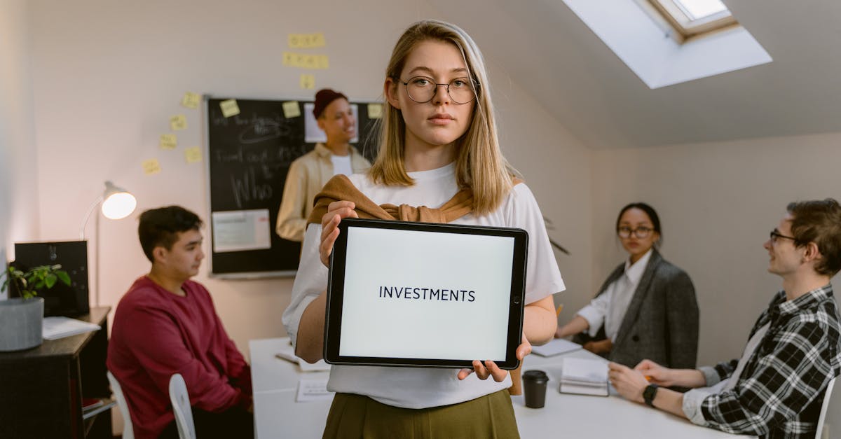 A diverse group of business professionals having an investment meeting indoors.